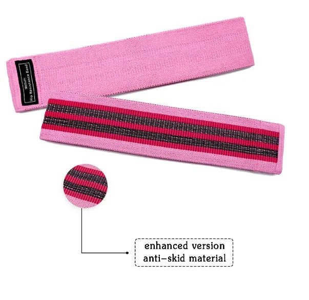 Set of three coloured fabric resistance bands and a net storage bag for home fitness.
