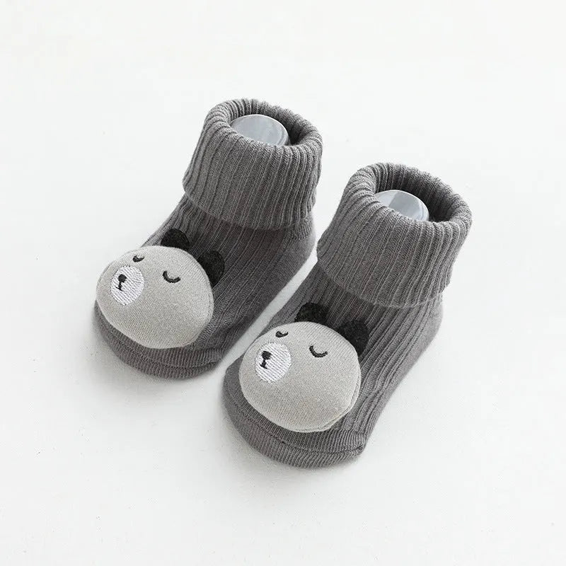Baby socks with anti-slip glue dots on soles in combed cotton, showing mid-tube height and various colour options