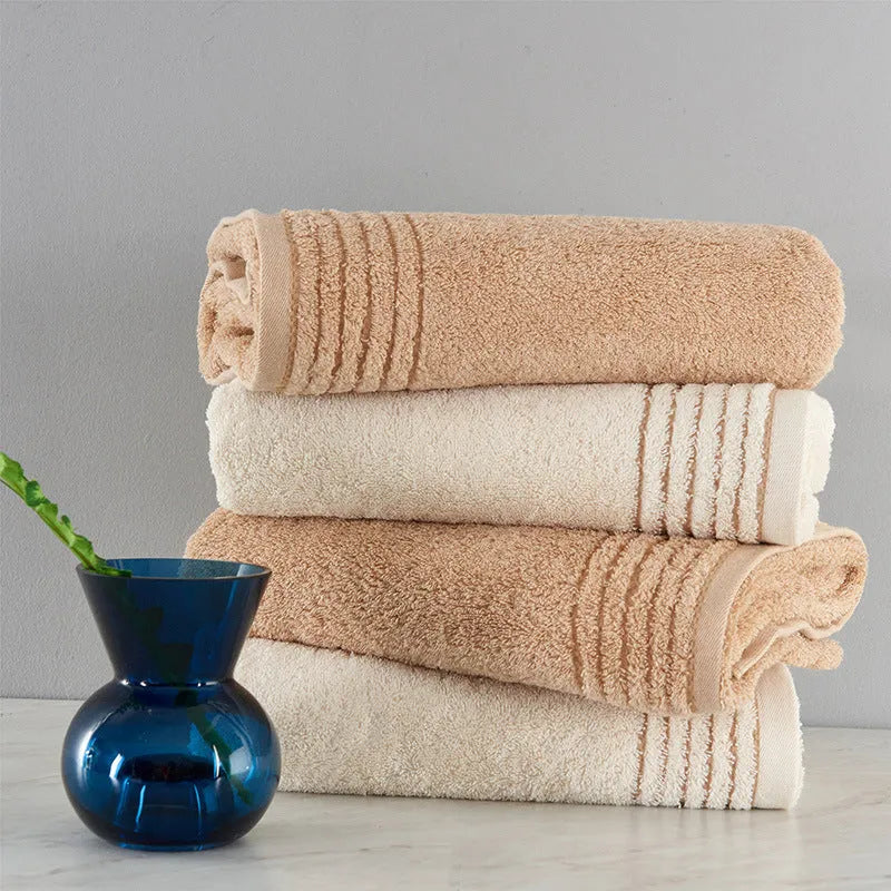 Cotton towel set showing three sizes in beige and brown colours for bathroom use
