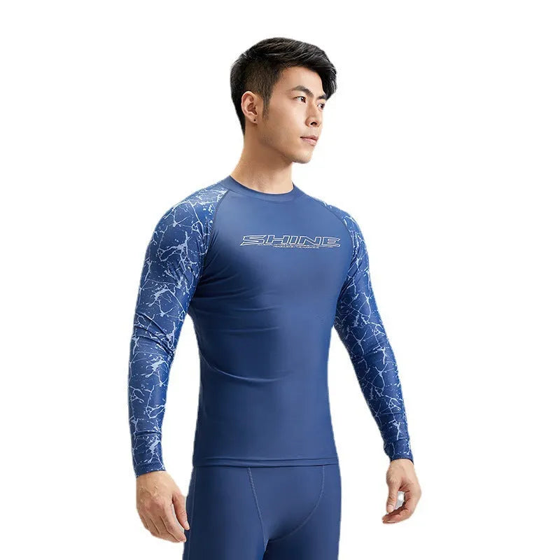Men's dark blue nylon swimwear set with pattern detail showing swim top and trunks