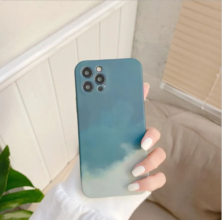 Soft silicone iPhone case with a blue and purple gradient geometric abstract pattern, shown on a phone.