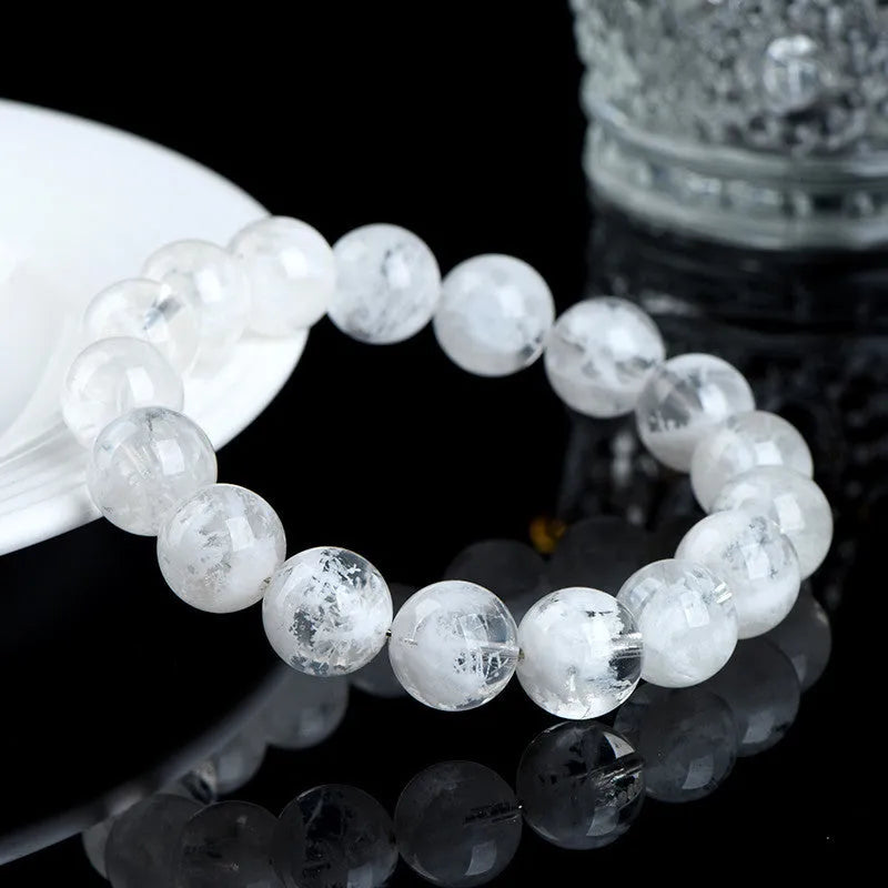 Crystal women's bracelet with natural blizzard snowflake round beads in geometric shapes with traditional decorative elements