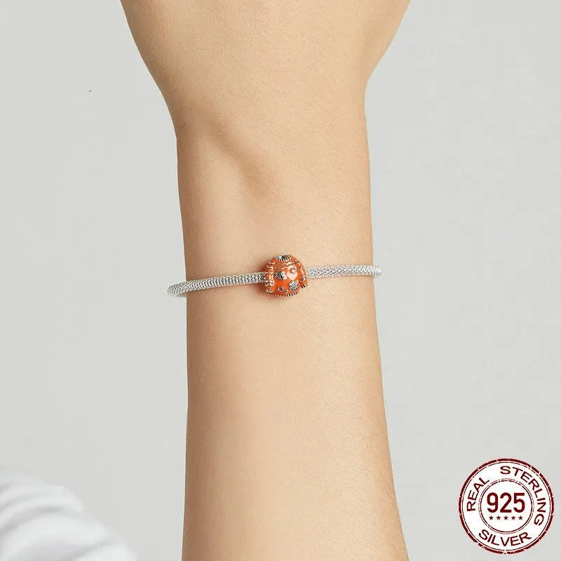 925 sterling silver bead with dripping oil finish, 1.1cm height and width, 0.45cm aperture, colour SCC1998
