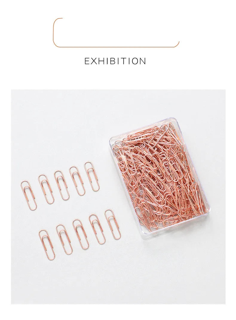Rose gold heart-shaped metal paper clips measuring 28mm with steel core construction