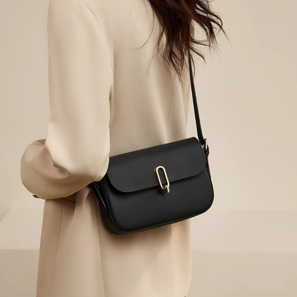 Black genuine leather square messenger bag with shoulder strap showing internal zipper pocket