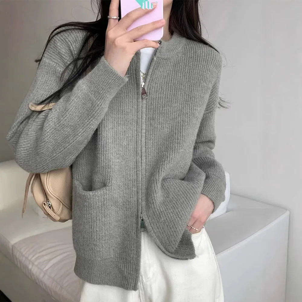 Beige viscose soft wind sweater coat, a long sleeve cardigan laid flat.