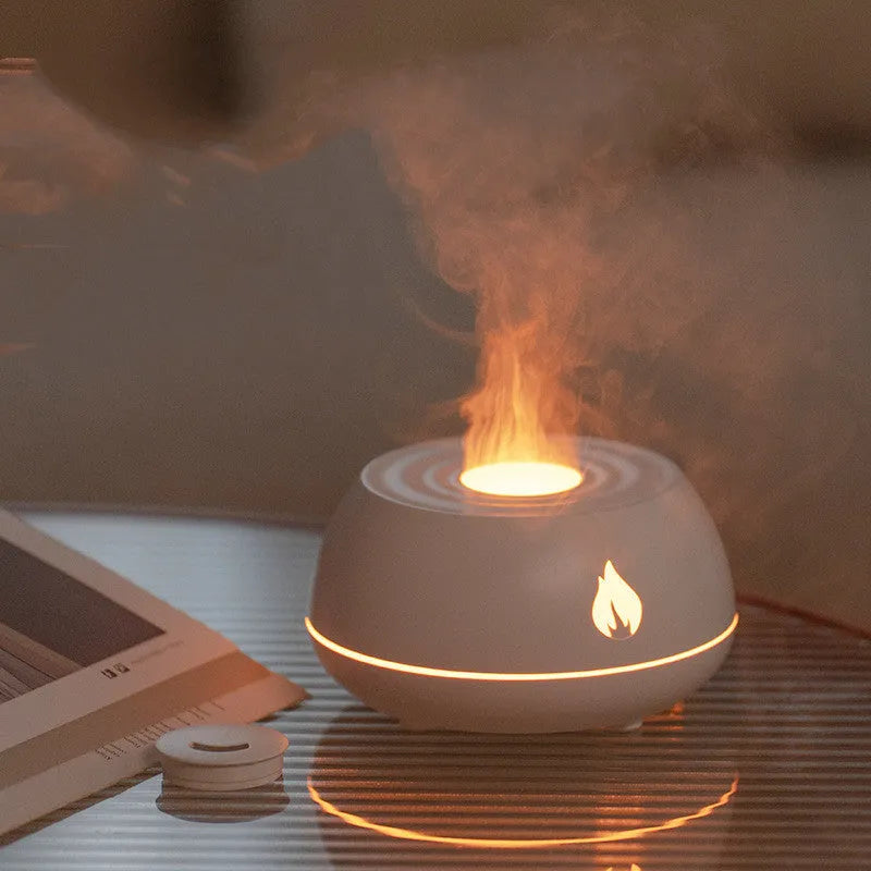 Black flame humidifier aroma diffuser with 130ml tank, 7 colour lights, and USB power on a wooden table