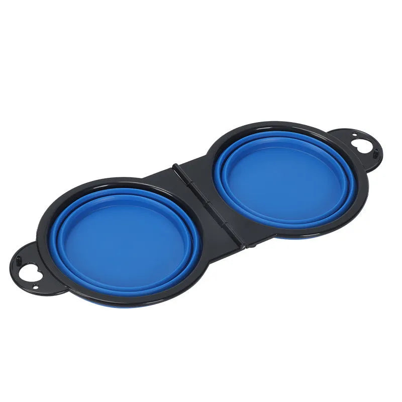 Blue silicone folding double pet bowl showing food and water compartments, folded flat beside it.