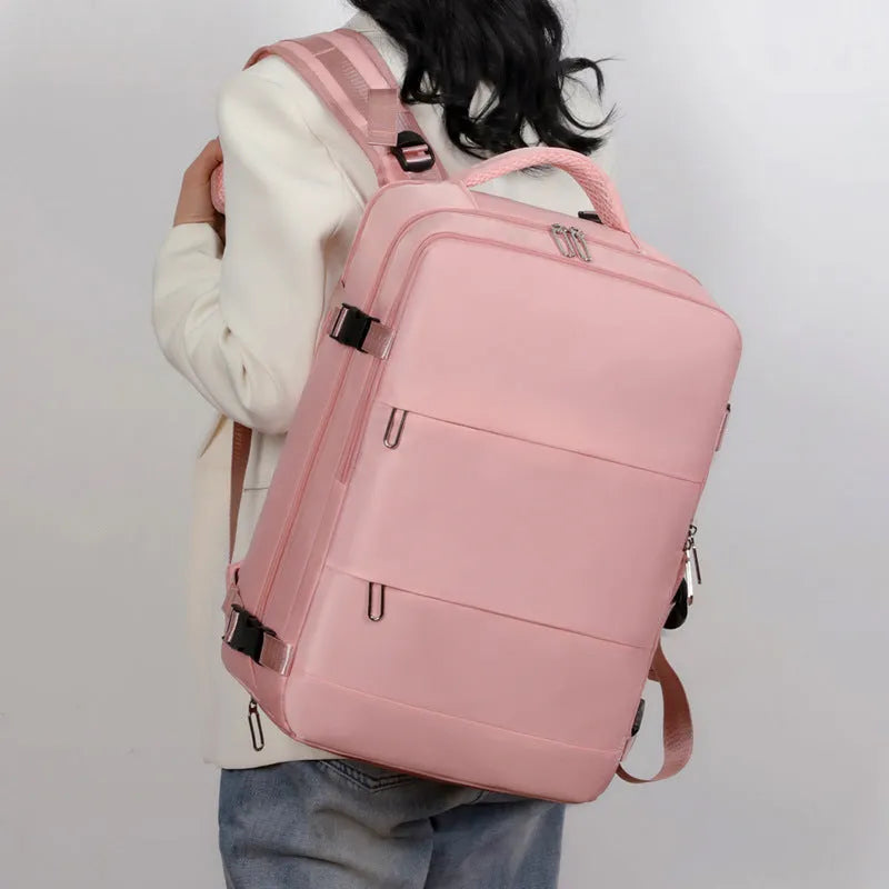 Large-capacity purple travel backpack with multiple compartments and air-pillow straps for organised travel