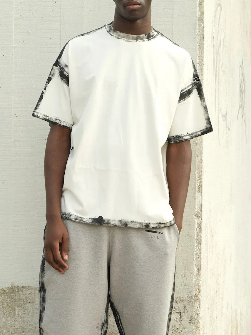 White casual short sleeve polyester top with draped design on a hanger