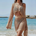 Women's khaki bell sleeve hollow out top and skirt vacation clothing set laid flat.