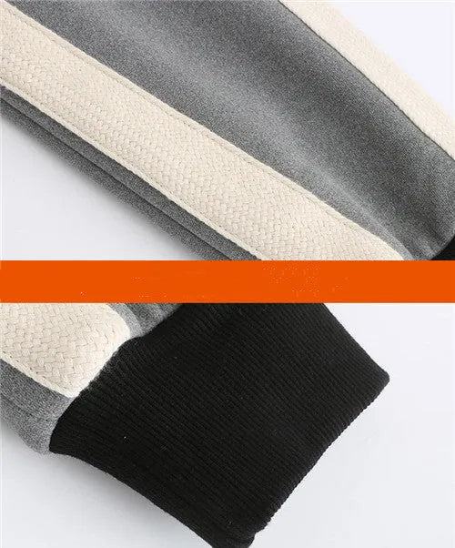 Women's USB heated jacket hoody in black, with brushed fabric and knitted construction, shown outdoors in cold weather
