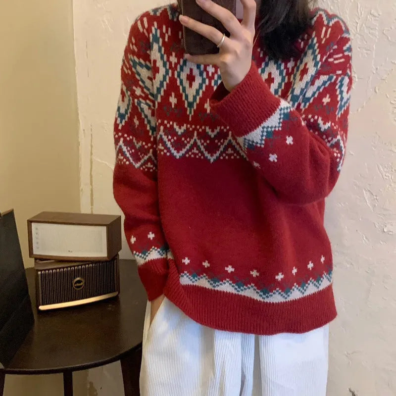 Red and white striped loose retro pullover knitted top on a hanger.