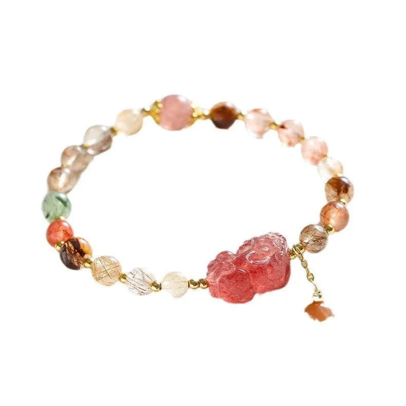 Women's copper bracelet with strawberry quartz crystal, Pixiu charm, and pearl beads.