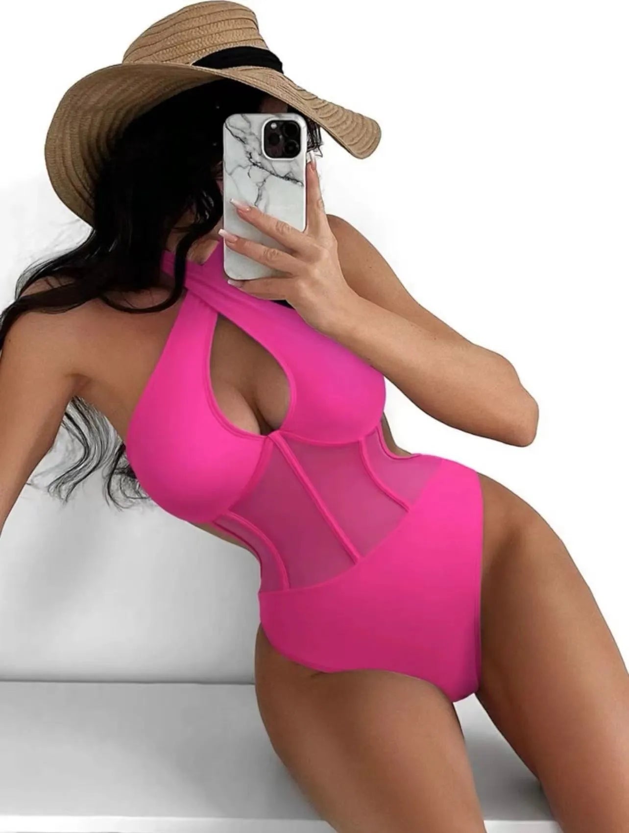 Black one-piece bikini swimsuit for women on a mannequin, showing the front design.