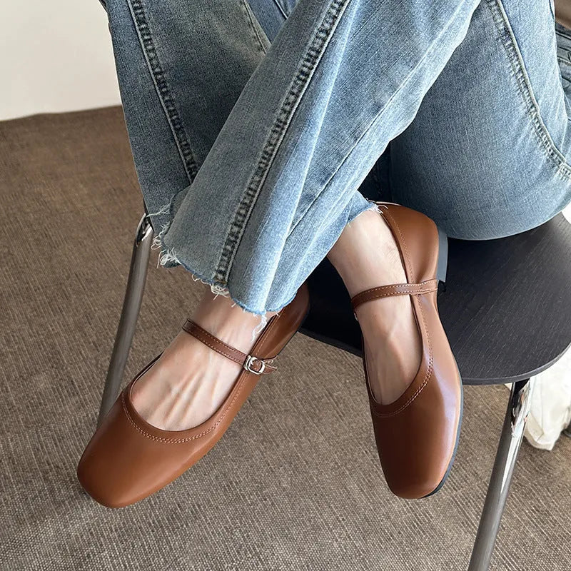 Retro style Mary Jane flat shoes in sheepskin with pigskin lining, shown in a solid colour with round toe and low heel.