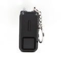 Pink personal safety alarm keychain with button, shown next to its white product box.