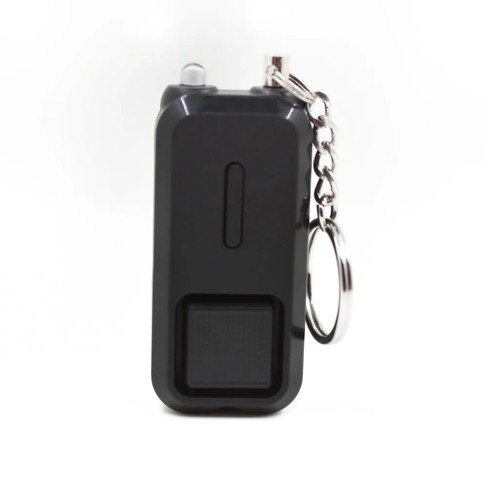 Pink personal safety alarm keychain with button, shown next to its white product box.
