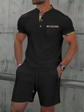 Men's grey short sleeve zip-front polo top and matching shorts on a hanger.