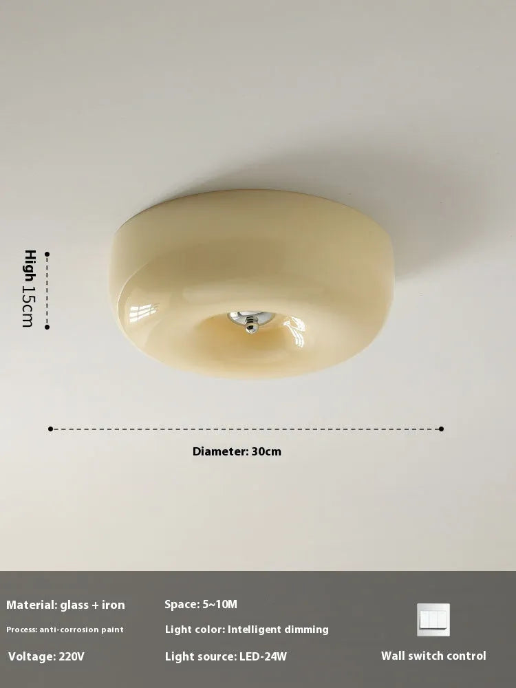 American style cream coloured bedroom ceiling lamp with three-colour light fitting on a white ceiling.
