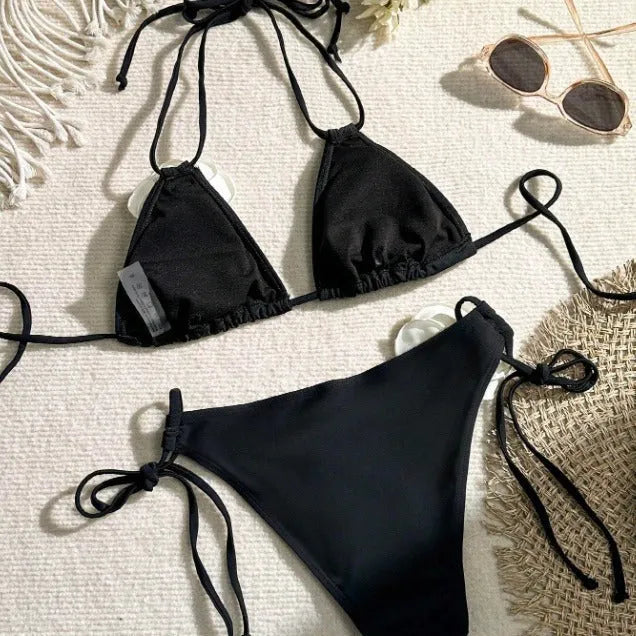 Black women's two-piece bikini with 3D floral lace detail on drawstring waistband, backless design.