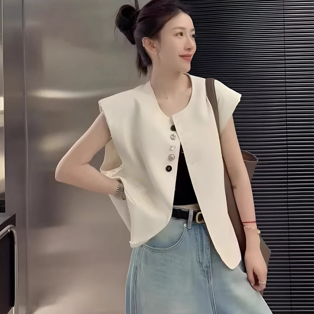 Women's loose-fit short polyester vest in milky white with a pocket, shown on a hanger.