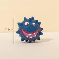 Four colourful squeaky dog balls with cute faces made from natural latex rubber