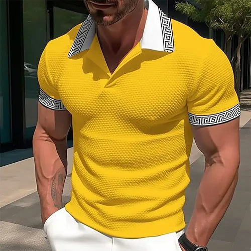 Man wearing a loose fit striped short-sleeved T-shirt in a casual setting