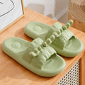 Deer horn design EVA flip flop slippers in light yellow on a white background.