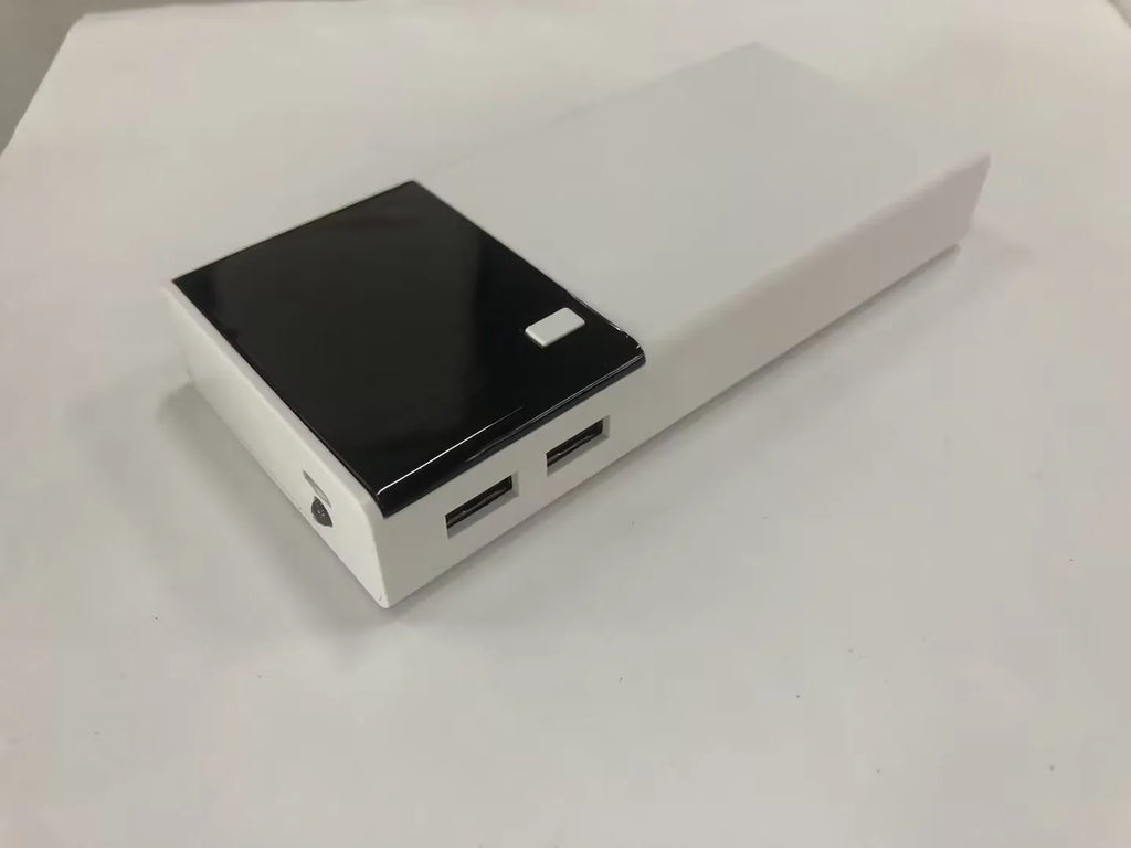 Black 20000mAh power bank with charging cable showing compact rectangular design