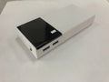 Black 20000mAh power bank with charging cable showing compact rectangular design