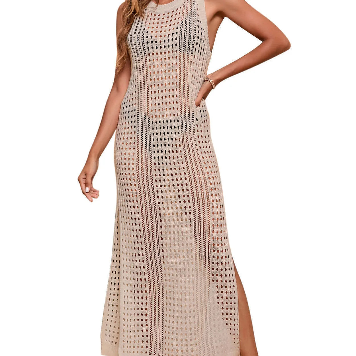 Long loose solid colour beach cover-up blouse with hollow-out knitted design on a hanger.