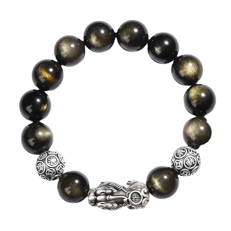 Men's geometric bracelet with obsidian stone set in 999 sterling silver on a wrist.