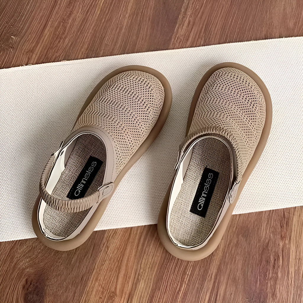 Beige linen slip-on shoes with a round toe and breathable mesh lining on a soft rubber sole.