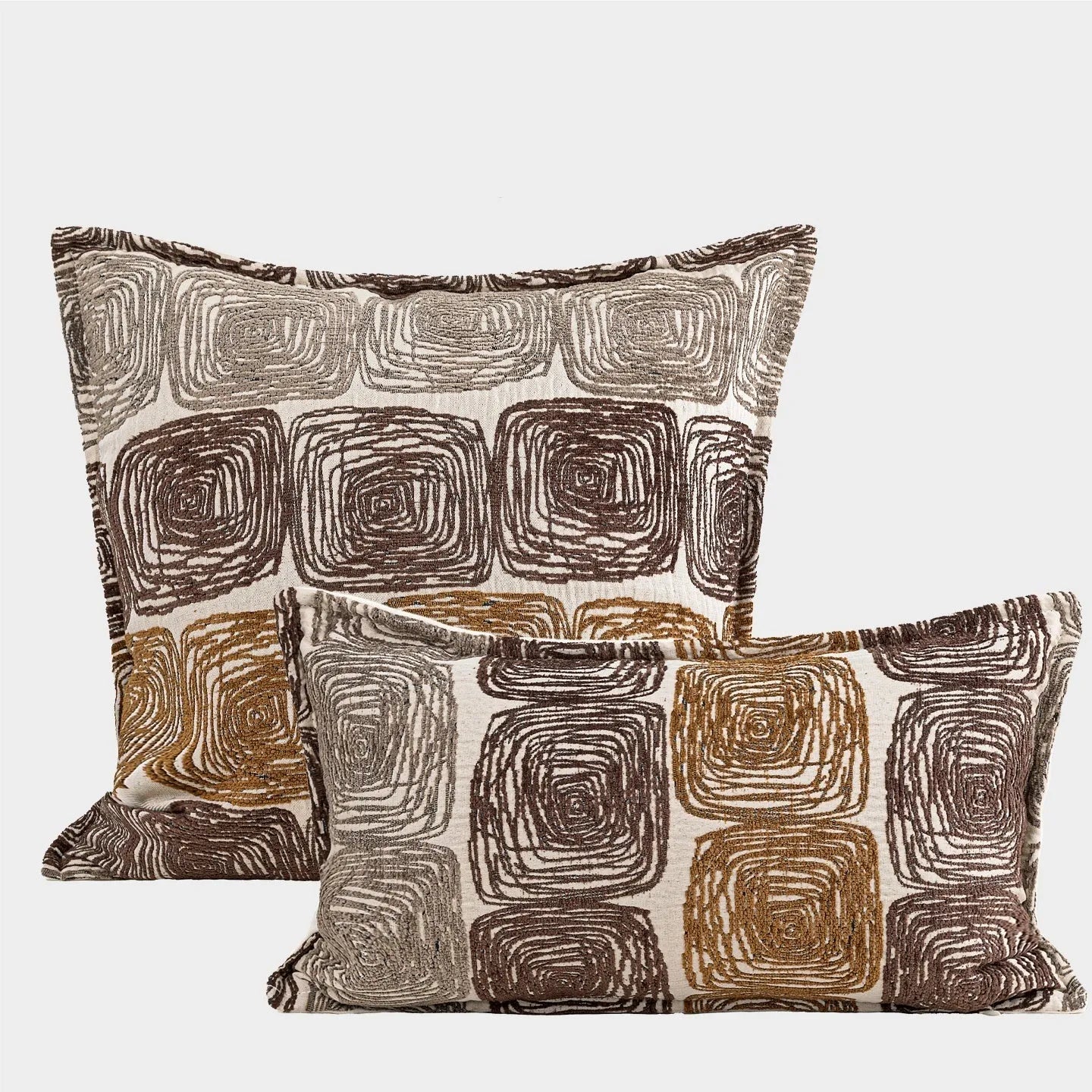 Cream and coffee-coloured abstract coil pattern on a 30x50cm square polyester pillow cover.