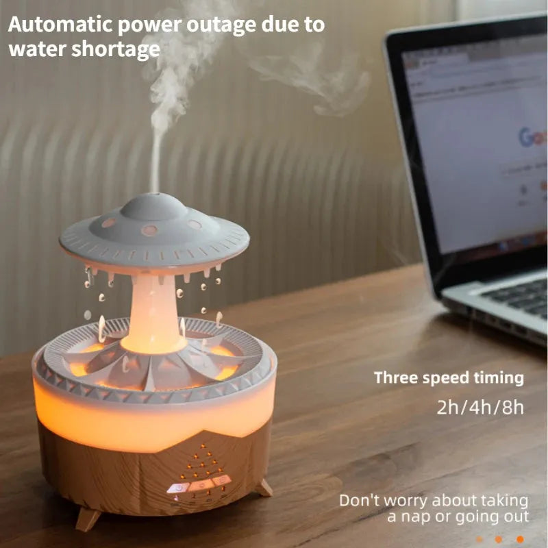 White cloud-shaped humidifier with water droplets and coloured lights on wooden surface