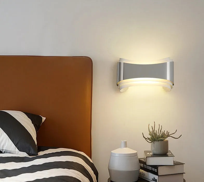 Modern white LED wall lamp with rectangular PMMA shade on a wall.