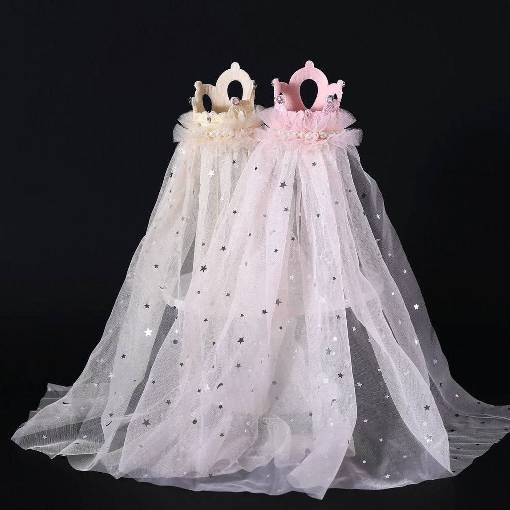 Pet cat wearing princess crown headdress with veil for wedding or celebration