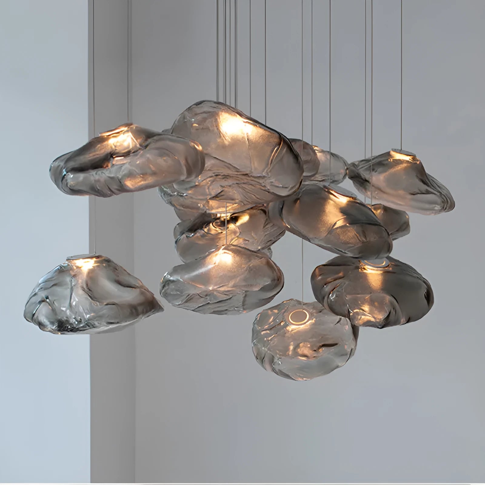 Postmodern glass decorative chandelier with LED lighting in amber, clear, or smoke grey colours