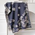 Long grey cashmere-like winter scarf with tassels, shown draped to display its length and texture.