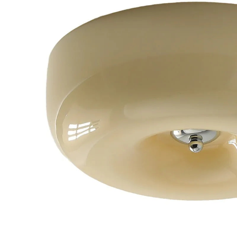 American style cream coloured bedroom ceiling lamp with three-colour light fitting on a white ceiling.