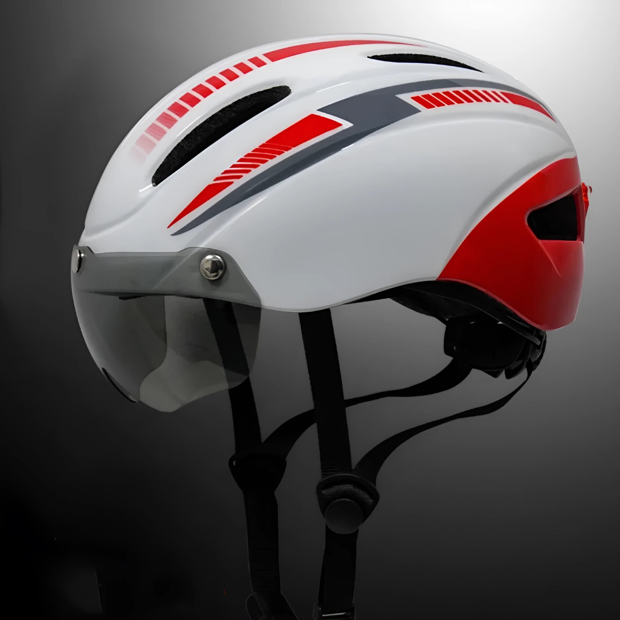 Adult bicycle helmet with integrated rear red taillight shown in a black and blue colour variant.