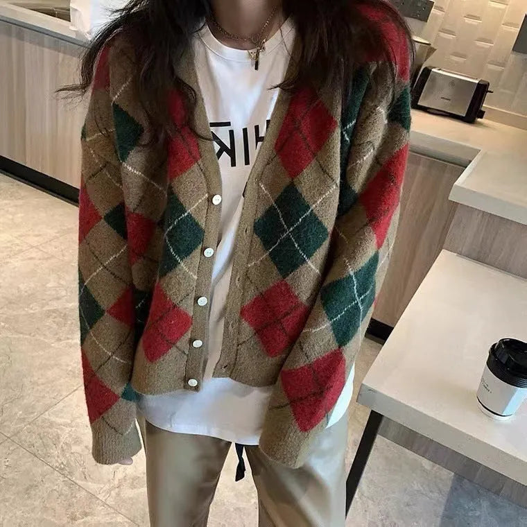 A knitted casual cardigan coat in a macaron colour, shown on a hanger with regular sleeves.