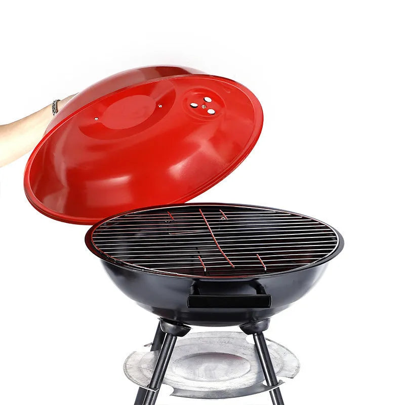 Portable 14-inch iron barbecue grill with Apple stove design on a patio.