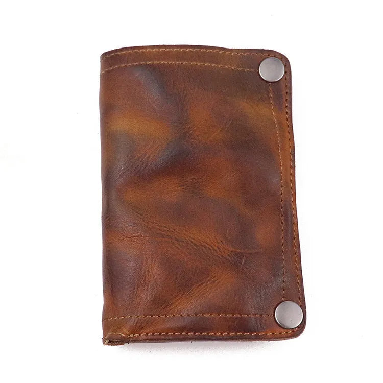 Men's brown leather bifold wallet open showing multiple card slots and coin pocket