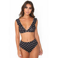 Black and white polka dot women's bikini set with a deep V-neck top and ruffled trim.