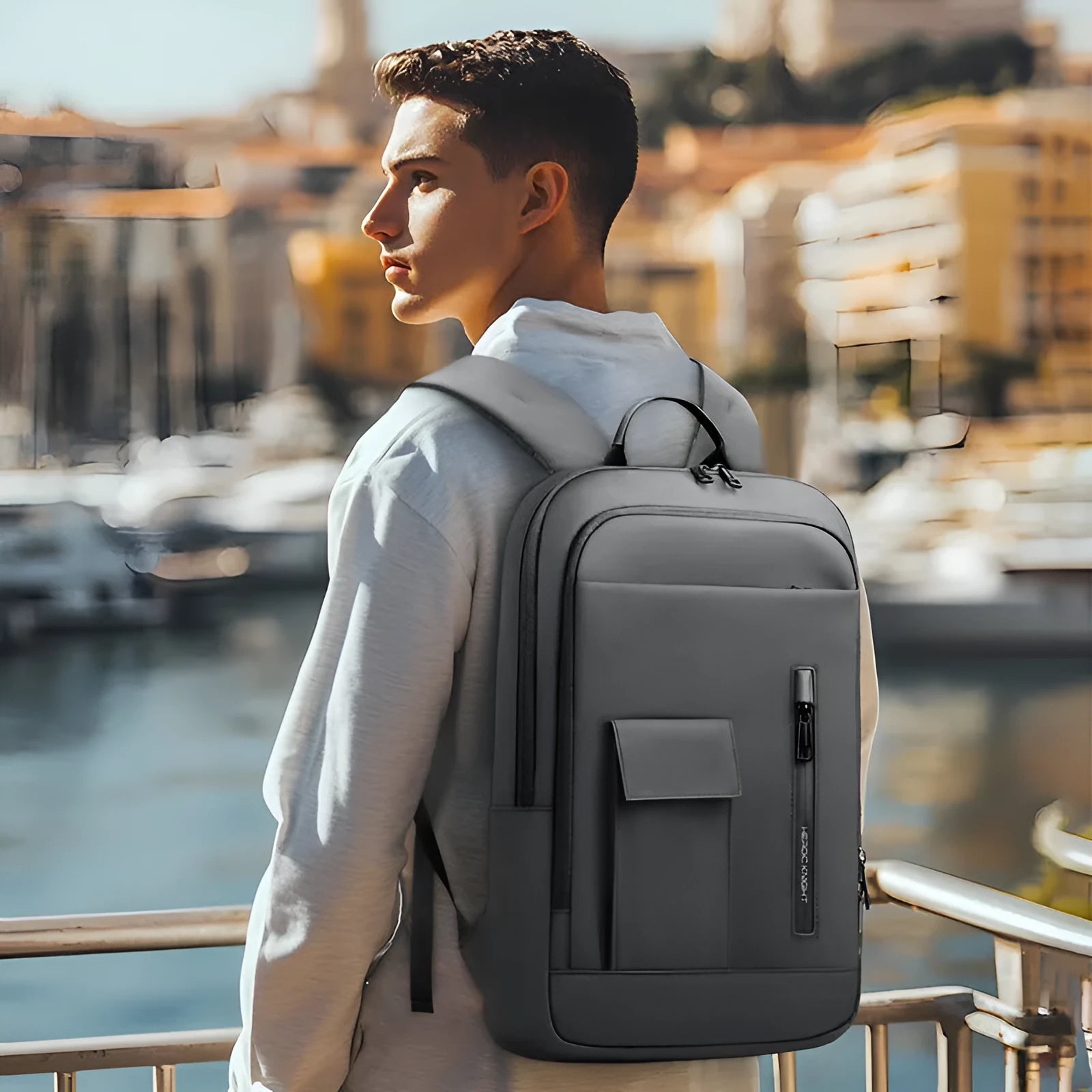 Men's lightweight Oxford cloth backpack in dark grey with sewing line detail.