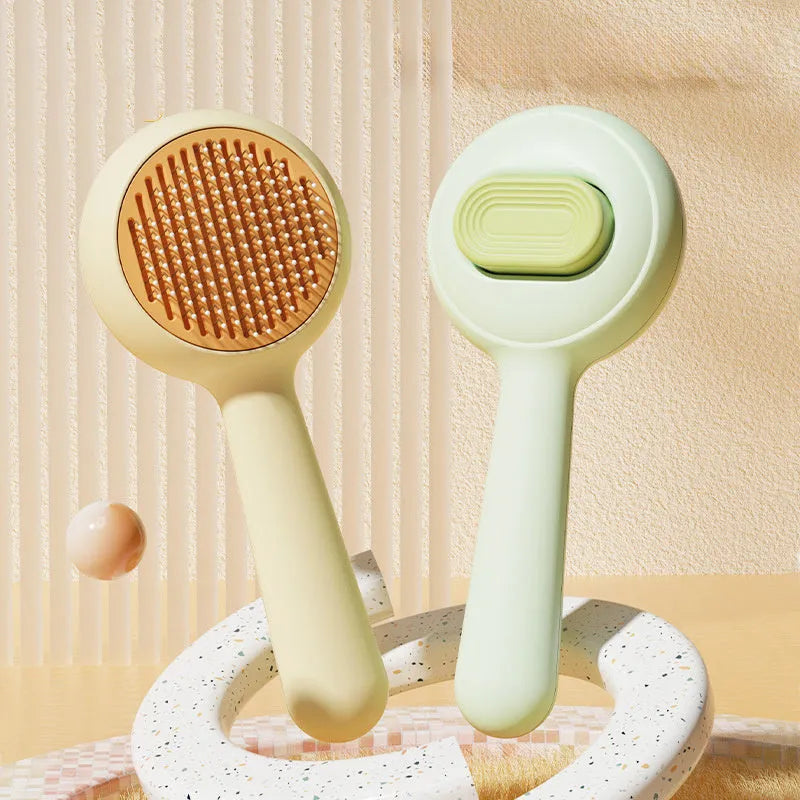 Green and yellow cat grooming brushes with stainless steel teeth and non-slip handles for pet hair removal