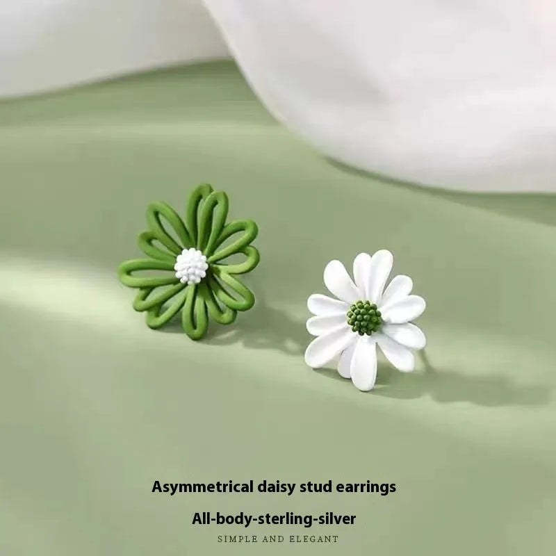 Close-up of colourful cartoon flower stud earrings in alloy on a white background.