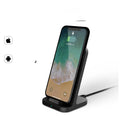 Dark grey vertical wireless charger for Apple iPhone on desktop